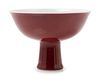 A Copper Red Glazed Porcelain Stem BowlHeight 4 1/4 x diam 5 7/8 in., 10.8 x 14.9 cm.