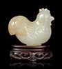 A Carved Pale Celadon and Russet Jade Figure of Rooster Height of rooster 2 in., 5 cm.