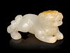 A Russet and White Jade Figure of a Recumbent Beast
Length 2 1/4 in., 5.7 cm. 