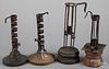 Four tin, iron, and wood candlesticks