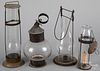 Four tin and glass carry lanterns, 19th c.