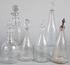 Six engraved colorless glass decanters, 19th c.