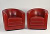 Pair of red leather barrel back club chairs