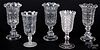 Five colorless glass vases