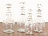 Four etched colorless glass decanters