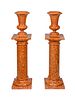 A Pair of Red Marble Urns on Pedestals Height 53 1/2 inches.