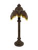 A Moroccan Pierced Brass Floor Lamp with Beaded Fringe Shade Height 75 inches.