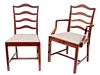 A Set of Fourteen George III Style Mahogany Ladder Back Dining Chairs
Height 36 3/4 inches.