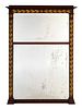 A Neoclassical Style Gilt Metal Mounted Mahogany Trumeau-style Mirror
Height 53 3/4 x width 37 1/2 inches.