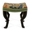An Italian Carved and Ebonized Bench
Height 18 1/2 x width 20 x depth 15 1/2 inches.