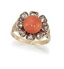 A CORAL AND DIAMOND CLUSTER RING
 The cabochon cor