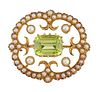 A PERIDOT AND SEED PEARL BROOCH
 The lobed openwor
