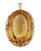 A CITRINE PENDANT
 The claw-set oval-cut citrine, 