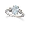 AN AQUAMARINE AND DIAMOND RING
 The claw-set oval-