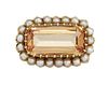 A TOPAZ AND HALF PEARL BROOCH
 The rectangular-cut