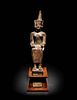 An Egyptian Gold Inlaid Bronze Seated Neith
Height 7 7/8 inches.