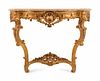 A Louis XV Style Giltwood Console
Height 36 x length 48 x depth 23 1/2 inches.