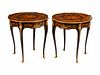 A Pair of Louis XV Style Gilt-Bronze-Mounted Marquetry Tables de Milieu
Height 30 x diameter 28 inches.