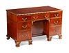 A George III Style Parcel-Gilt Mahogany Kneehole Desk
Height 29 1/2 x length 50 x depth 25 inches.