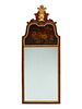A George III Parcel-Gilt Mahogany Mirror
Height 52 1/2 x width 20 inches.