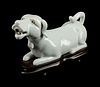 A Chinese Export Blanc de Chine Porcelain Figure of a Recumbent Dog
Height 4 1/2 x length 7 1/2 x depth 2 1/2 inches.