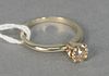 14 karat yellow gold and diamond engagement ring set with center diamond approximately .60 carats, size 5.25.