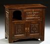 French Provincial Carved Walnut Nightstand, 20th c., the rectangular top over a fall front compartment right and open storage left,...