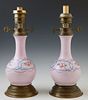 Pair of Old Paris Style Lavender Porcelain Bottle Form Oil Lamps, 19th c., with floral and polychromed decoration, on circular brass...