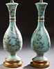 Pair of Oriental Porcelain Baluster Lamps, 20th c., with gilt, silver, and polychromed floral decoration on a pale blue ground, on s...