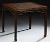 Chinese Carved Elm Side Table, late Ming Dynasty, the square top over a pierced carved skirt, on square tapered legs, H.- 27 3/4 in....