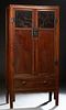 Chinese Tall Carved Elm Cabinet, 19th c., Qing Dynasty, the rectangular top over double two panel doors, the upper panel incised car...