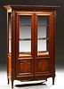 French Louis XVI Style Carved Cherry Vitrine, 20th c., the dentillated stepped crown over double beveled glazed doors with fielded l...