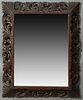 French Provincial Henri II Style Carved Beech Overmantel Mirror, late 19th c., the pierced leaf and scroll frame around a scroll and...