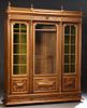 Exceptional French Henri II Style Carved Walnut Bookcase, c. 1880, the pierced finialed crown over a setback center door with a glaz...