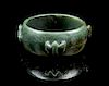 * A Carved Spinach Jade Bracelet Diameter overall 3 1/2 inches.