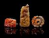 A Group of Three Carved Hardstone Pendants Height of largest 3 1/4 inches.