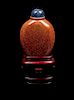 * A Peking Glass Simulating Goldstone Snuff Bottle Height 2 5/8 inches.