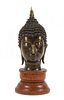 * A Southeast Asian Bronze Head of Buddha Height overall 9 1/4 inches.