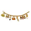 A 18K yellow gold, diamond, colored gemstone, enamel and mother-of-pearl charms bracelet
