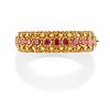 A 18K yellow gold, ruby and pearl bangle