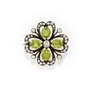 A silver, yellow gold, diamond and green gemstone brooch