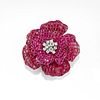 A 18K white gold, ruby and diamond brooch, defects