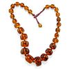 A metal and amber necklace
