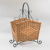 Magazine Rack. 20th century. Made of woven wicker and iron. Decorated with geometric elements, scrolls and lace.