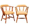 Pair of armchairs. 20th century. Carved in wood. With semi-open backrests and beige leatherette seats.