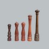 Lot of 5 pepper shakers. Twentieth century. In wood carving. Decorated with ringed elements and metal applications.