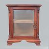 Cigar humidifier. United States. Twentieth century. Cigar Chest Co. brand. Wood carving. With hinged glass door.