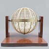 Tombola. Twentieth century. Spherical design. Made of gold metal and carved wood. Includes content.