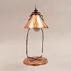 Desk lamp. Twentieth century. Made of bronze. Electrified for a light. Decorated with organic elements.