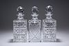 THREE LARGE SQUARE-SECTION GLASS DECANTERS. 26.5c